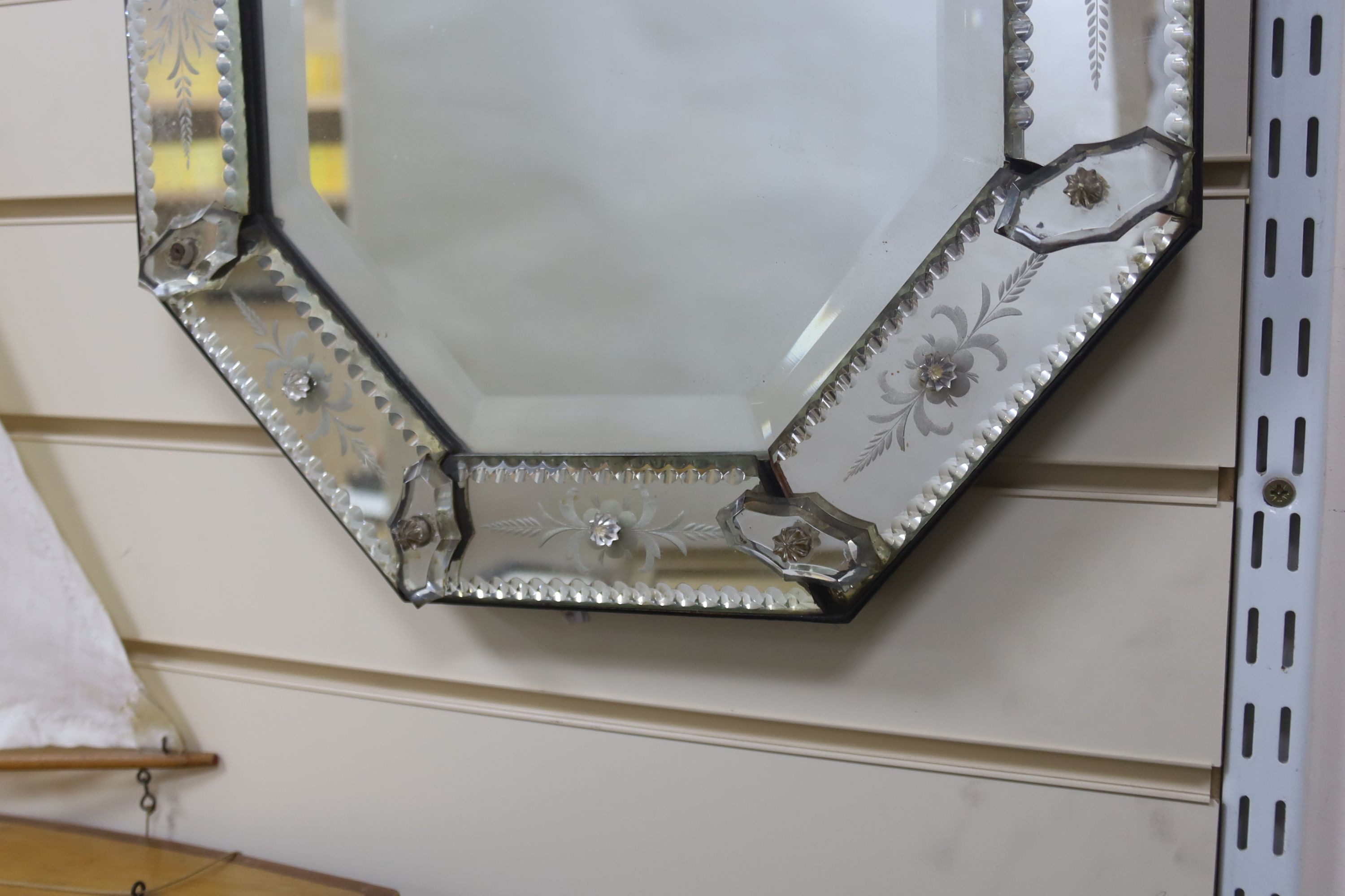 A 19th century Venetian glass mirror, 40 cms wide x 61 cms high.